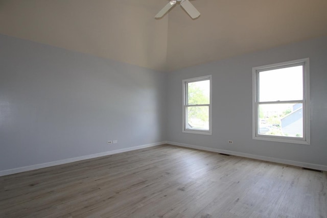 1960 Slippery Rock Rd, Naperville, IL 60565 - spare room featuring light wood finished floors, baseboards, a ceiling fan, and high vaulted ceiling