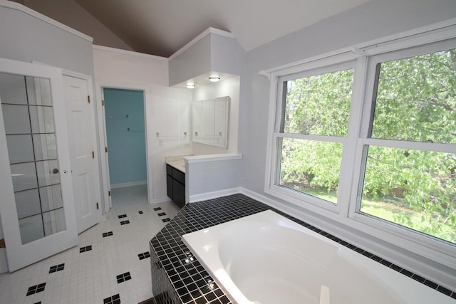 1960 Slippery Rock Rd, Naperville, IL 60565 - bathroom with vaulted ceiling, a bath, vanity, baseboards, and tile patterned floors