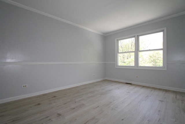 1960 Slippery Rock Rd, Naperville, IL 60565 - spare room featuring wood finished floors, crown molding, and baseboards