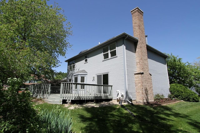 1960 Slippery Rock Rd, Naperville, IL 60565 - rear view of house featuring a chimney, a lawn, and a wooden deck