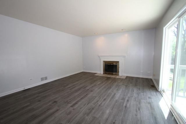 1960 Slippery Rock Rd, Naperville, IL 60565 - unfurnished living room featuring dark wood-style flooring, a brick fireplace, and baseboards