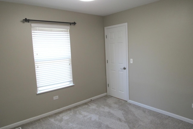 164 Blue Heron Ct, Round Lake, IL 60073 - carpeted empty room featuring healthy amount of natural light and baseboards