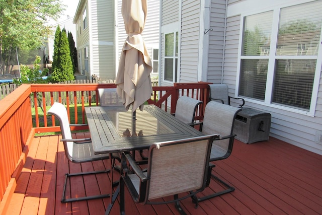 164 Blue Heron Ct, Round Lake, IL 60073 - wooden terrace featuring a trampoline and outdoor dining area