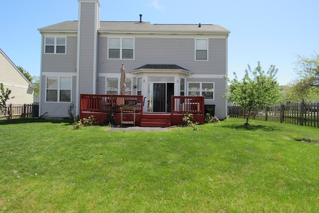 164 Blue Heron Ct, Round Lake, IL 60073 - rear view of house with a chimney and a deck
