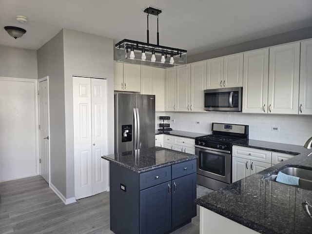 164 Blue Heron Ct, Round Lake, IL 60073 - kitchen featuring appliances with stainless steel finishes, a sink, tasteful backsplash, and white cabinets