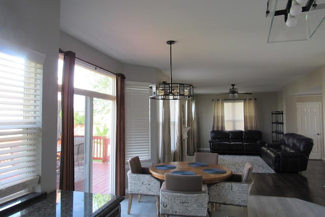 164 Blue Heron Ct, Round Lake, IL 60073 - dining room with a chandelier, wood finished floors, and ceiling fan