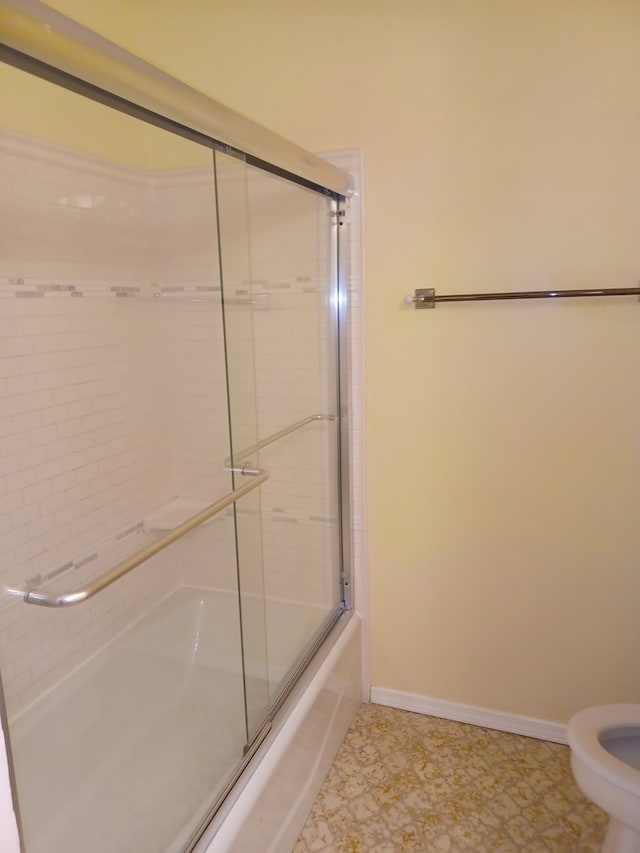 70 Old Oak Dr Unit 226, Buffalo Grove, IL 60089 - full bath featuring baseboards, toilet, and bath / shower combo with glass door