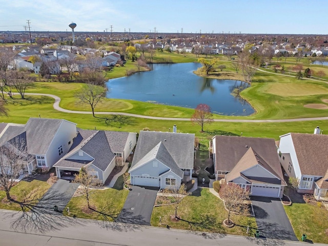 aerial view of residential area with a nearby body of water and a local golf course