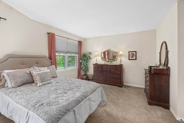 bedroom featuring carpet flooring and baseboards