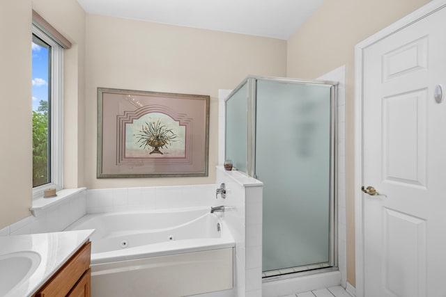 full bathroom with a shower stall, a jetted tub, and vanity