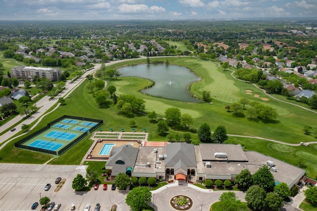 drone / aerial view of a nearby body of water and a golf club