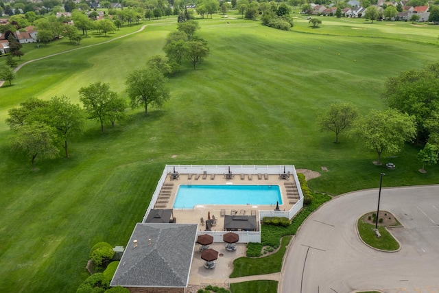 bird's eye view of a pool area and a golf club