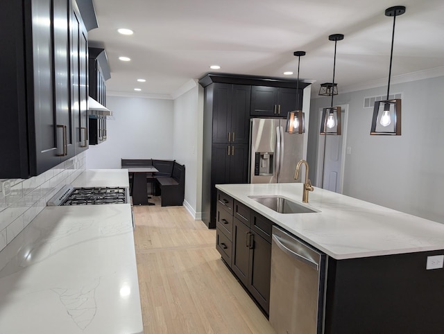 27W075 Fleming Dr, Winfield, IL 60190 - kitchen with a sink, appliances with stainless steel finishes, ornamental molding, light wood finished floors, and light stone countertops