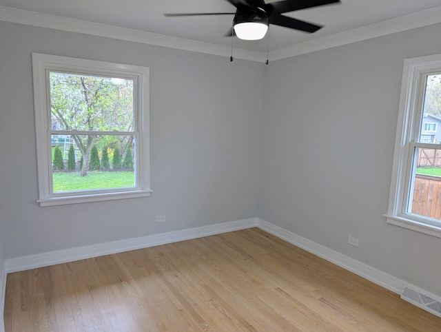 27W075 Fleming Dr, Winfield, IL 60190 - empty room featuring light wood-style flooring, baseboards, ceiling fan, and crown molding