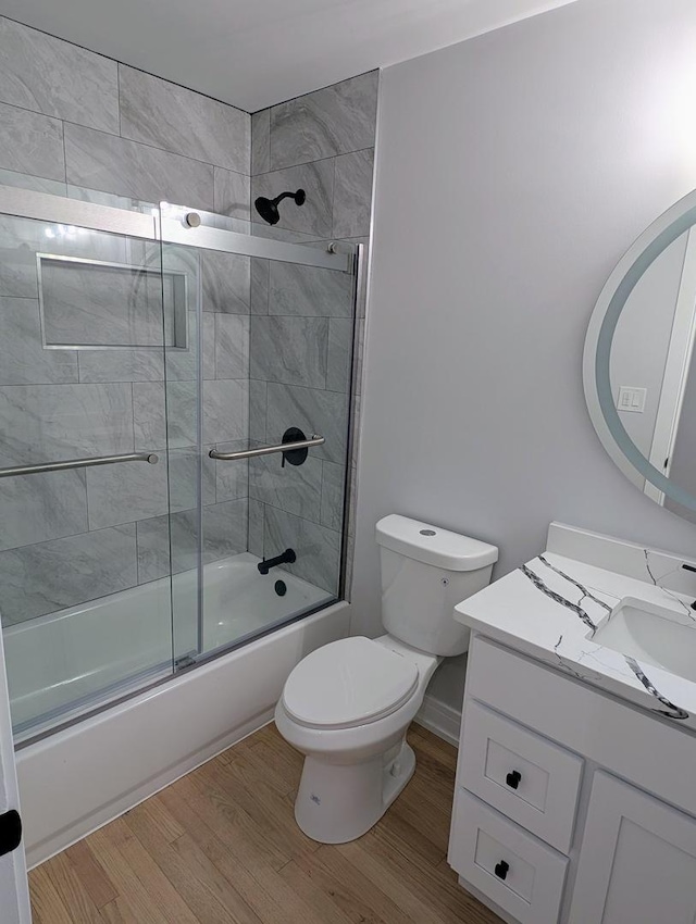 27W075 Fleming Dr, Winfield, IL 60190 - bathroom with wood finished floors, toilet, shower / bath combination with glass door, and vanity