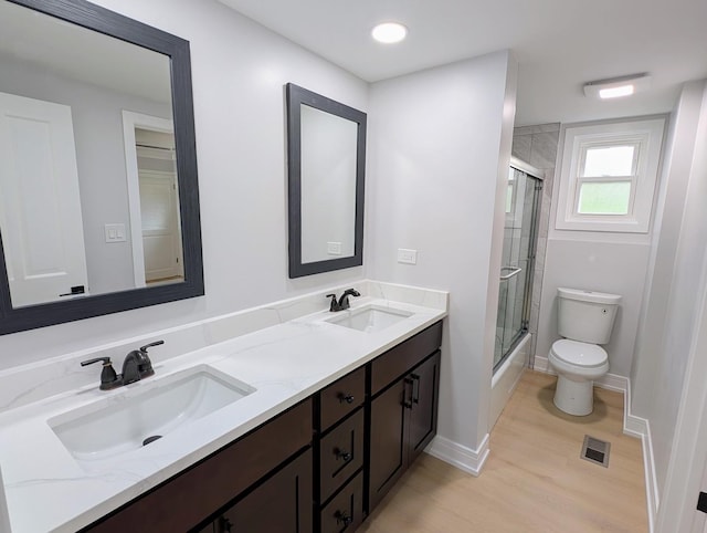 27W075 Fleming Dr, Winfield, IL 60190 - full bath featuring wood finished floors, toilet, double vanity, and baseboards