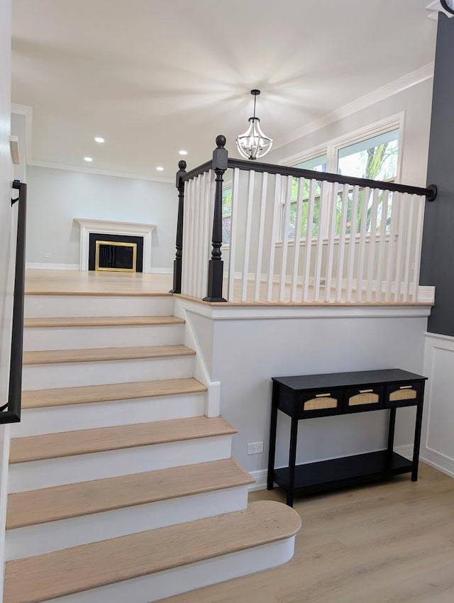 27W075 Fleming Dr, Winfield, IL 60190 - stairway featuring a chandelier, wood finished floors, crown molding, and recessed lighting