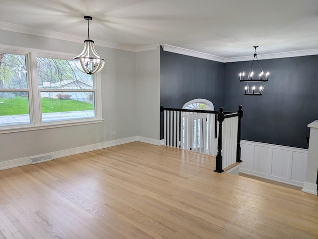 27W075 Fleming Dr, Winfield, IL 60190 - unfurnished dining area with a chandelier, wood finished floors, and ornamental molding