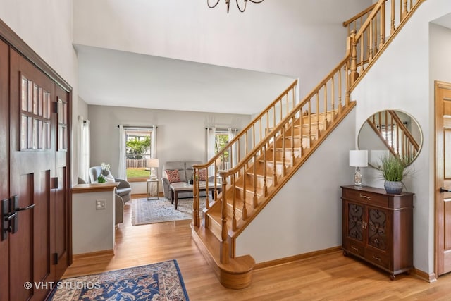 551 Salceda Ln, Mundelein, IL 60060 - entryway featuring stairs, light wood finished floors, baseboards, and a towering ceiling