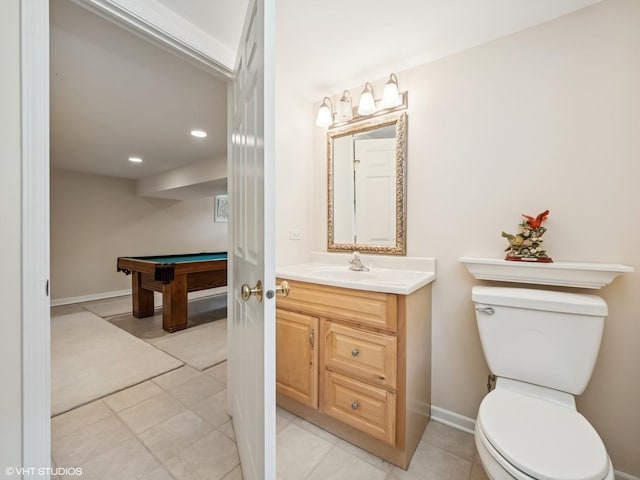 bathroom featuring pool table, toilet, vanity, recessed lighting, and baseboards