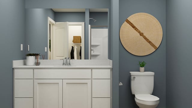 bathroom featuring toilet and vanity