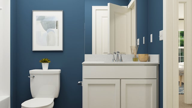 bathroom featuring toilet and vanity