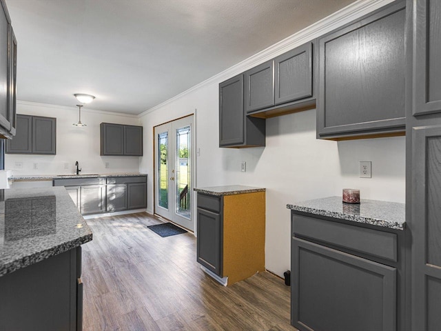 1659 Larchmont Rd, Davis, IL 61019 - kitchen with a sink, dark wood-type flooring, dark stone counters, crown molding, and gray cabinetry