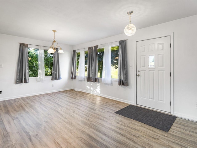 1659 Larchmont Rd, Davis, IL 61019 - foyer entrance with a chandelier, wood finished floors, and healthy amount of natural light
