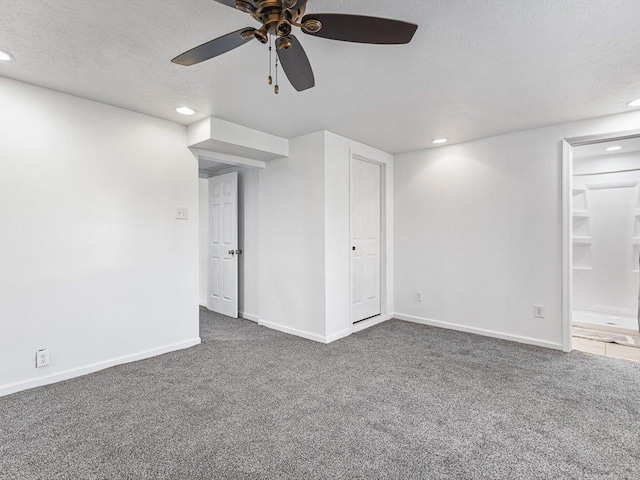 1659 Larchmont Rd, Davis, IL 61019 - below grade area with a textured ceiling, a ceiling fan, carpet floors, recessed lighting, and baseboards