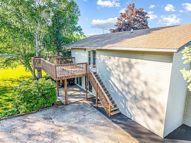 1659 Larchmont Rd, Davis, IL 61019 - back of property with a patio area, stairs, a deck, and roof with shingles