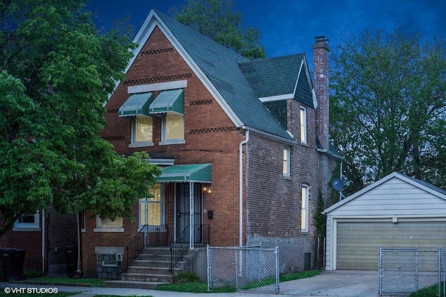 6945 S Eberhart Ave, Chicago, IL 60637 - tudor house featuring a chimney, an outdoor structure, fence, brick siding, and a gate