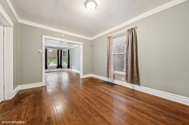 6945 S Eberhart Ave, Chicago, IL 60637 - empty room with ornamental molding, hardwood / wood-style flooring, and baseboards