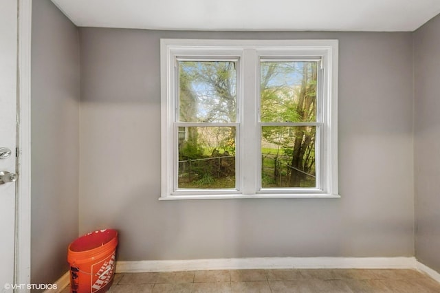 6945 S Eberhart Ave, Chicago, IL 60637 - spare room featuring baseboards and tile patterned floors