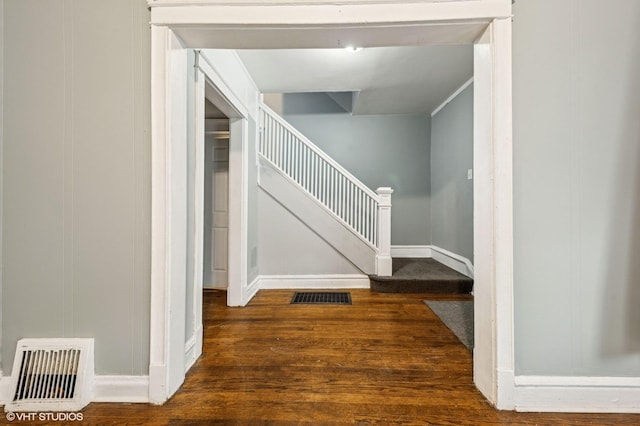 6945 S Eberhart Ave, Chicago, IL 60637 - corridor featuring wood finished floors, stairway, and baseboards
