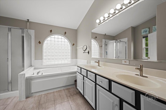 343 Diane Ct, Geneva, IL 60134 - bathroom featuring a shower stall, double vanity, a bath, and lofted ceiling