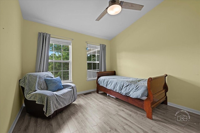 343 Diane Ct, Geneva, IL 60134 - bedroom featuring wood finished floors, vaulted ceiling, baseboards, and ceiling fan