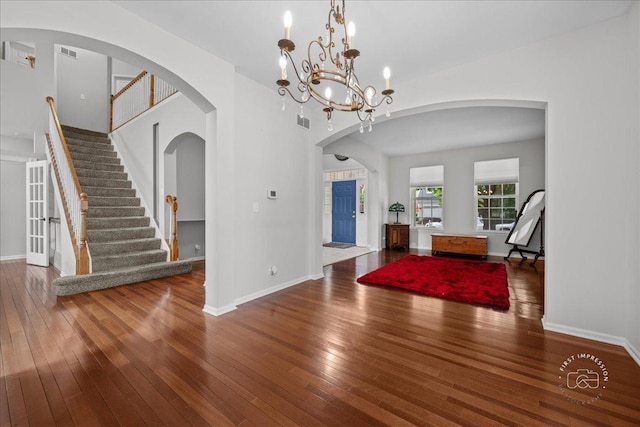 343 Diane Ct, Geneva, IL 60134 - entrance foyer featuring wood-type flooring, stairway, and arched walkways