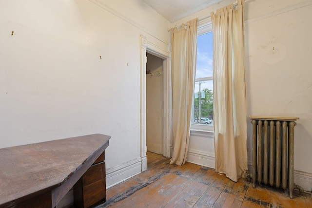 3230 W Fulton Blvd, Chicago, IL 60624 - unfurnished bedroom featuring radiator heating unit and hardwood / wood-style floors