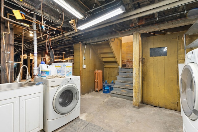 3230 W Fulton Blvd, Chicago, IL 60624 - laundry room featuring washer and dryer and wooden walls