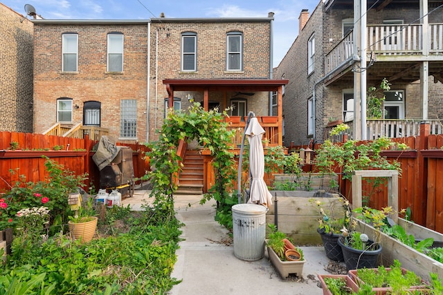 3230 W Fulton Blvd, Chicago, IL 60624 - view of front of home featuring a garden and brick siding