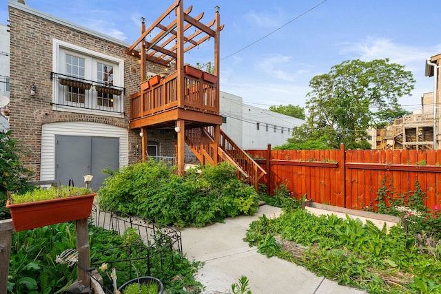 3230 W Fulton Blvd, Chicago, IL 60624 - back of property with brick siding, stairs, and a deck