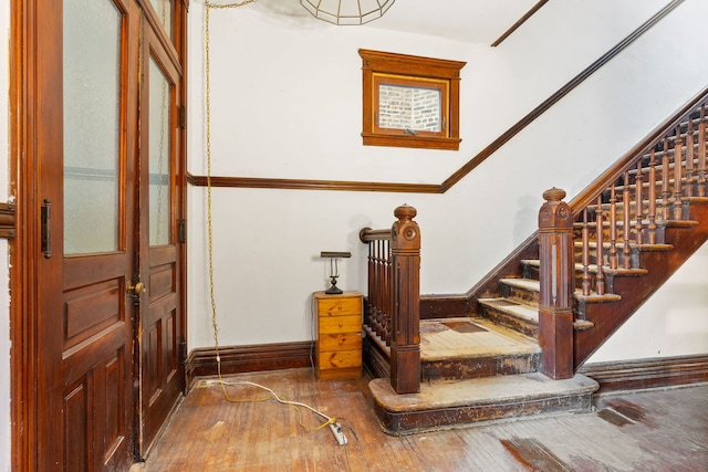 3230 W Fulton Blvd, Chicago, IL 60624 - staircase with hardwood / wood-style flooring and baseboards