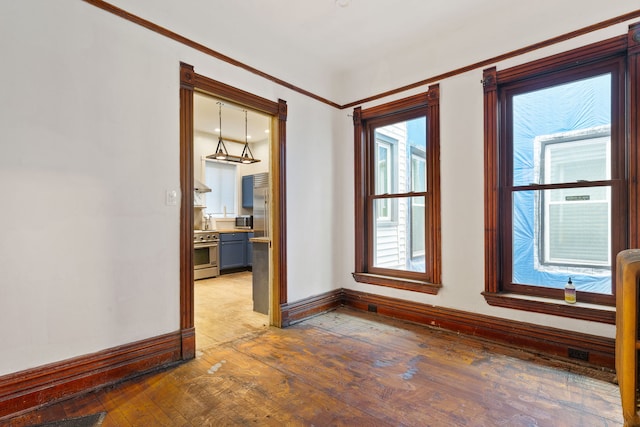 3230 W Fulton Blvd, Chicago, IL 60624 - unfurnished room featuring hardwood / wood-style floors, baseboards, and ornamental molding