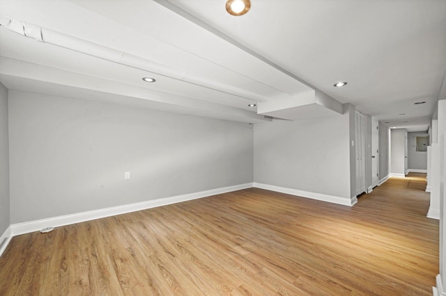 unfurnished room with baseboards, light wood-style floors, and recessed lighting