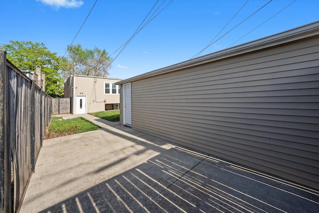 view of patio / terrace featuring fence