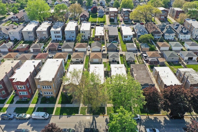 aerial view of property and surrounding area featuring nearby suburban area