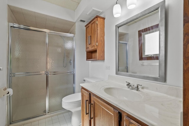 full bath featuring a shower stall, toilet, tile patterned flooring, and vanity