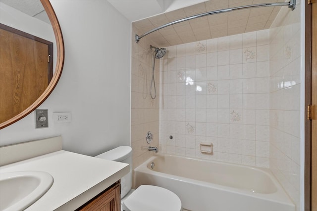 bathroom with toilet, bathtub / shower combination, and vanity