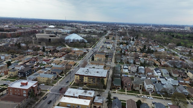 aerial view of property and surrounding area with nearby suburban area