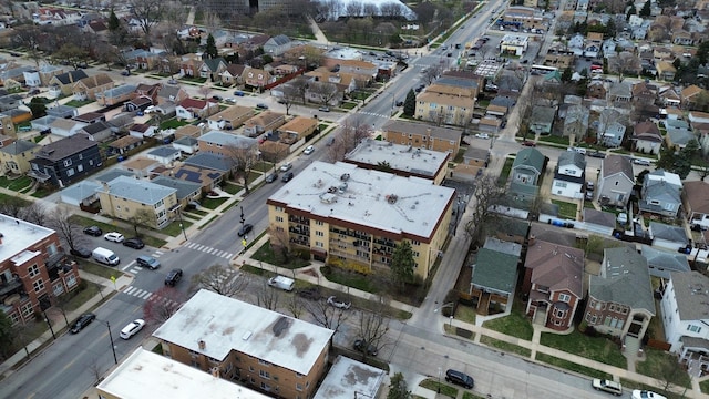 aerial view of property and surrounding area featuring nearby suburban area